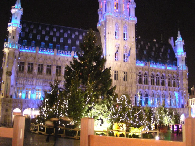 a large building with several spires and lit up lights