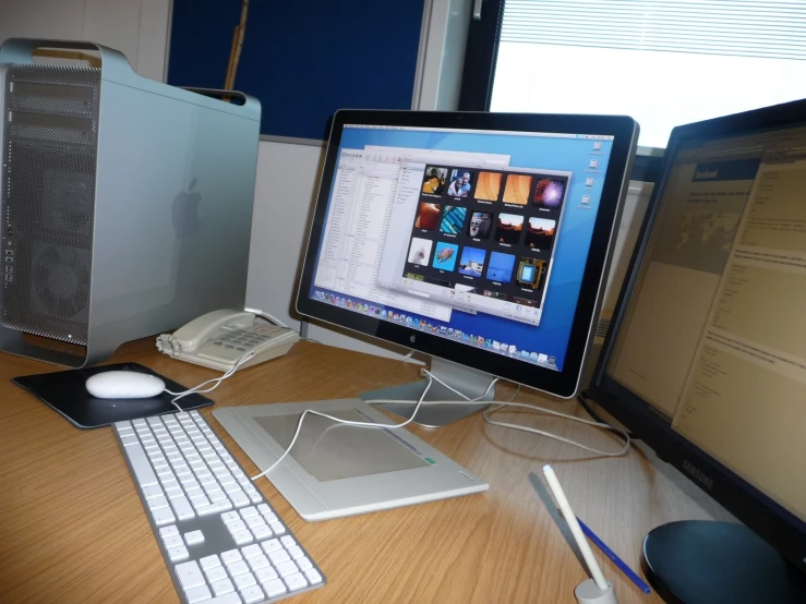 a desktop computer sitting on top of a wooden desk