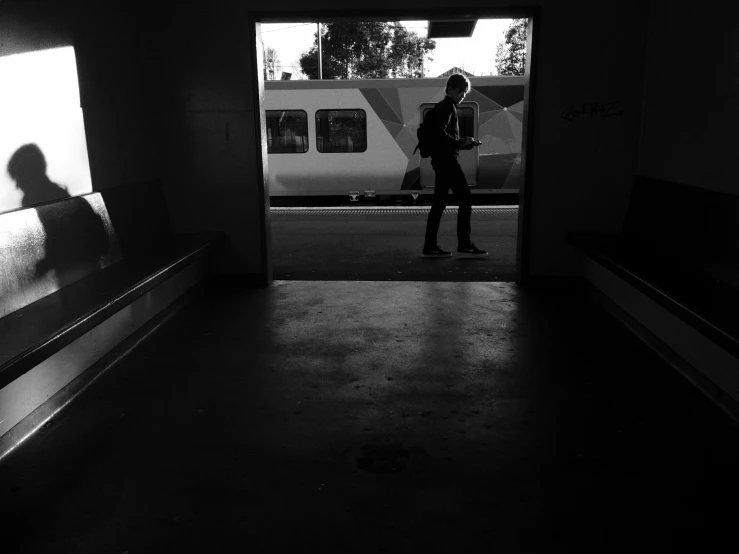 the silhouette of a person in a hallway