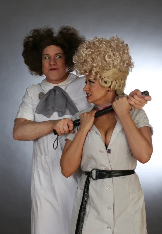 a woman helping another woman straightens her hair