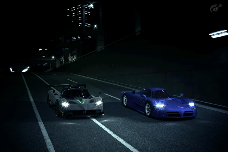 two supercars going down the road in the dark