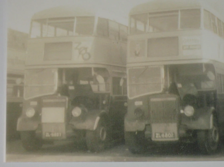 this black and white po shows double decker buses