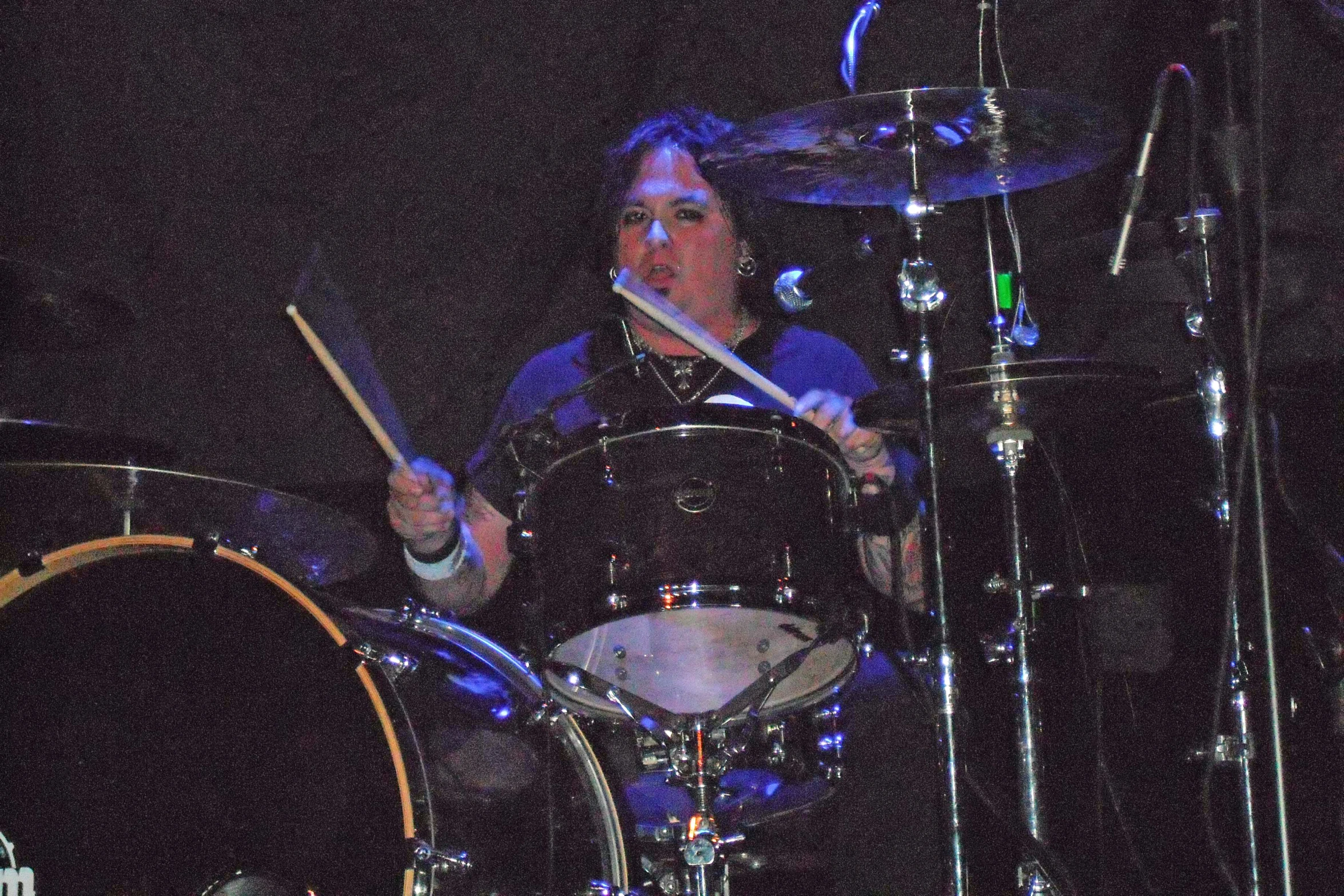 a person playing on a kit on stage