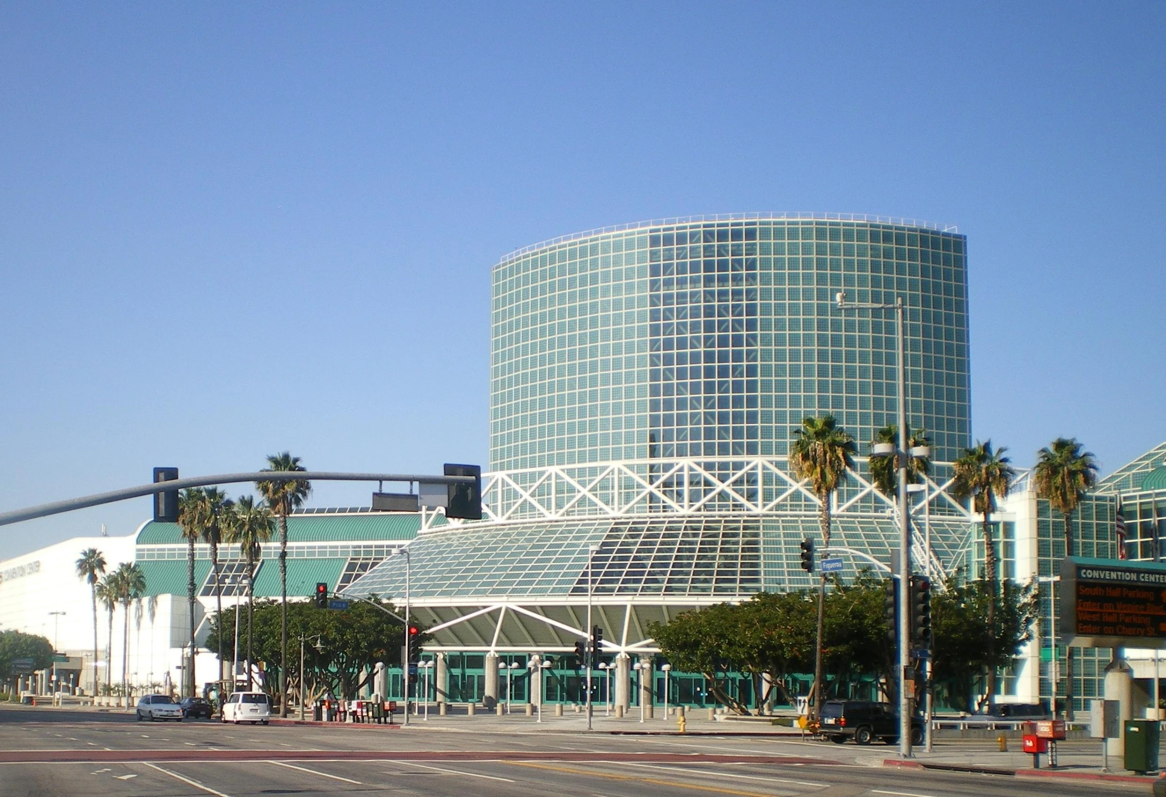 an intersection is shown with palm trees in the foreground