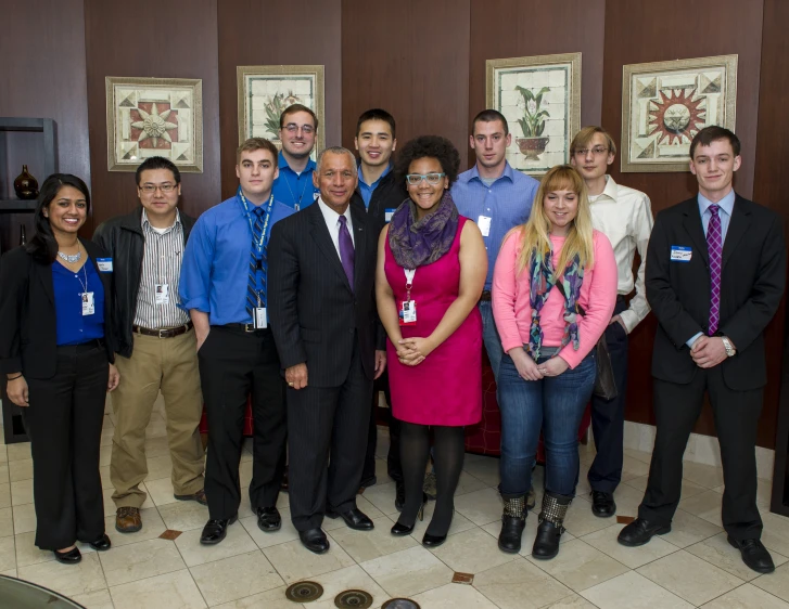 a group of people standing next to each other