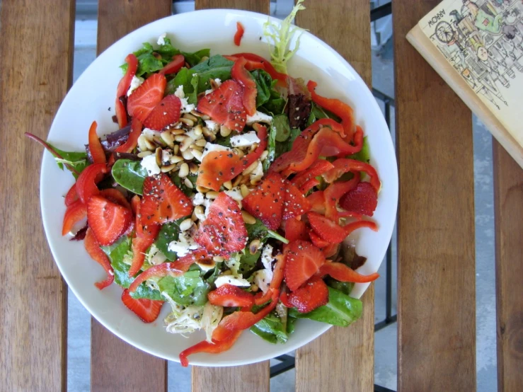 a salad on top of a plate on a table