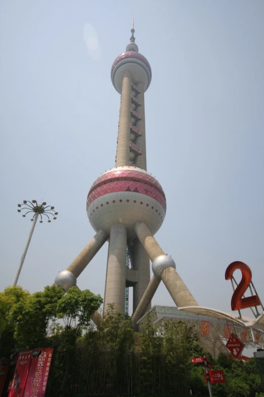 a large statue of an alien on top of a building