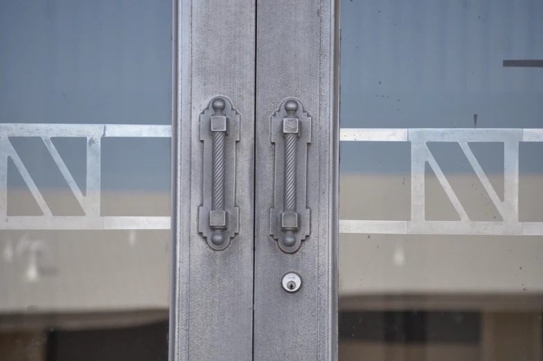 metal handles on double doors are clearly visible