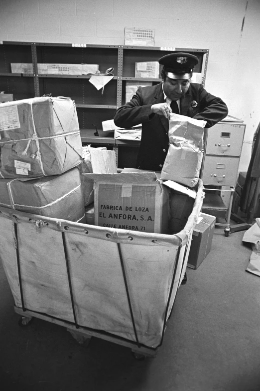 the captain of a cargo train loads out items to the ship