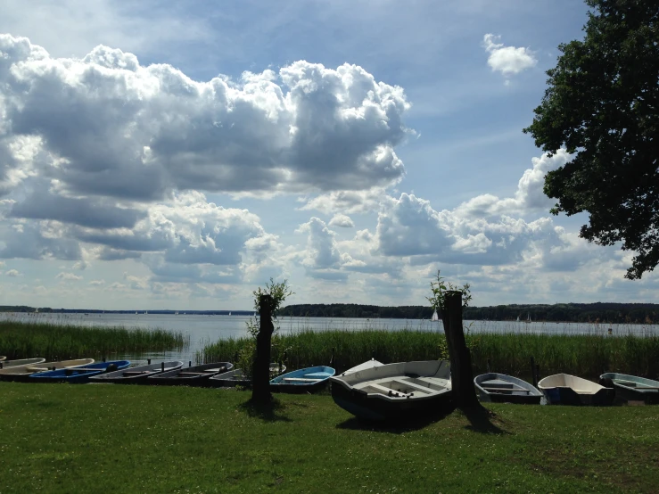 a view of a lake with boats docked near by