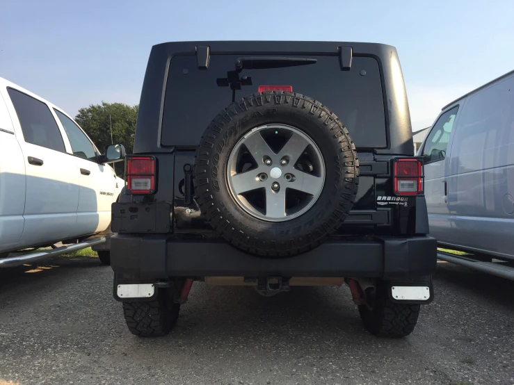 a large black jeep with two big tires