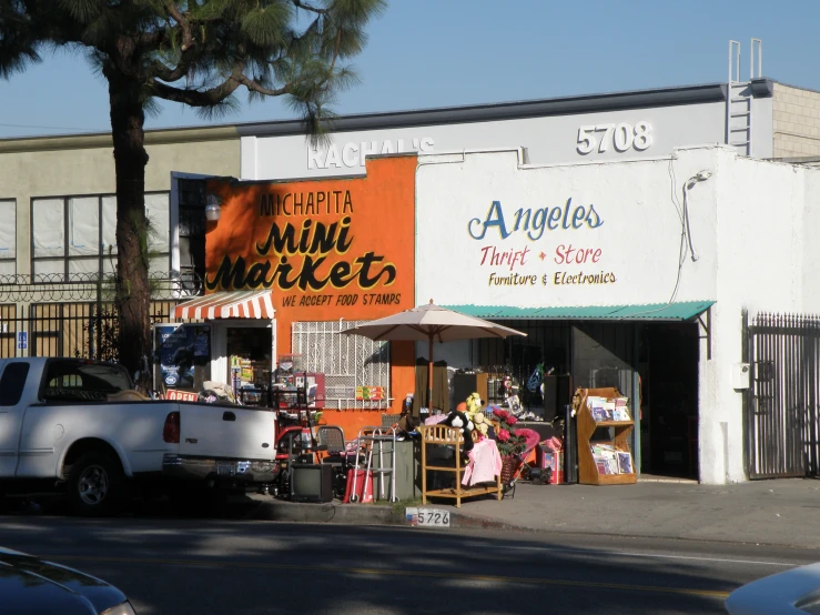 an older business with its outside furniture and decorations