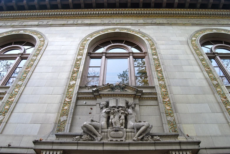 a tall white building with ornate windows