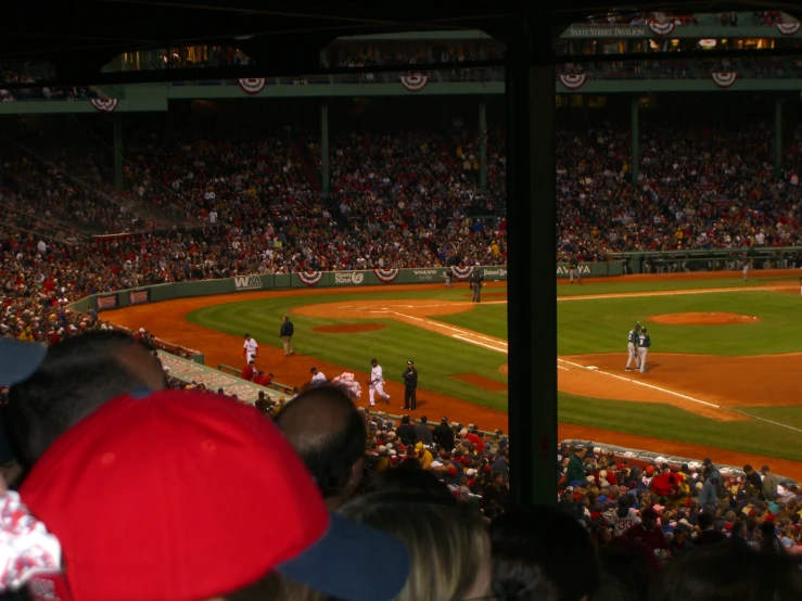 the crowd watching baseball game on the field