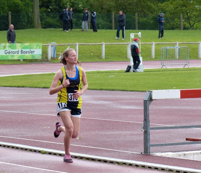 a woman is on the track as her marathon approaches