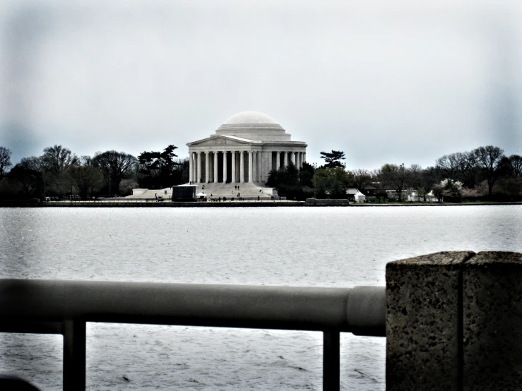 a long body of water that has a building in the middle