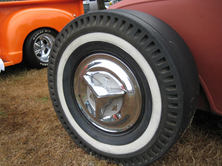 the reflection in the tire of a classic car