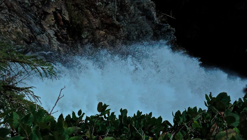 a view of some water going down the side of a hill