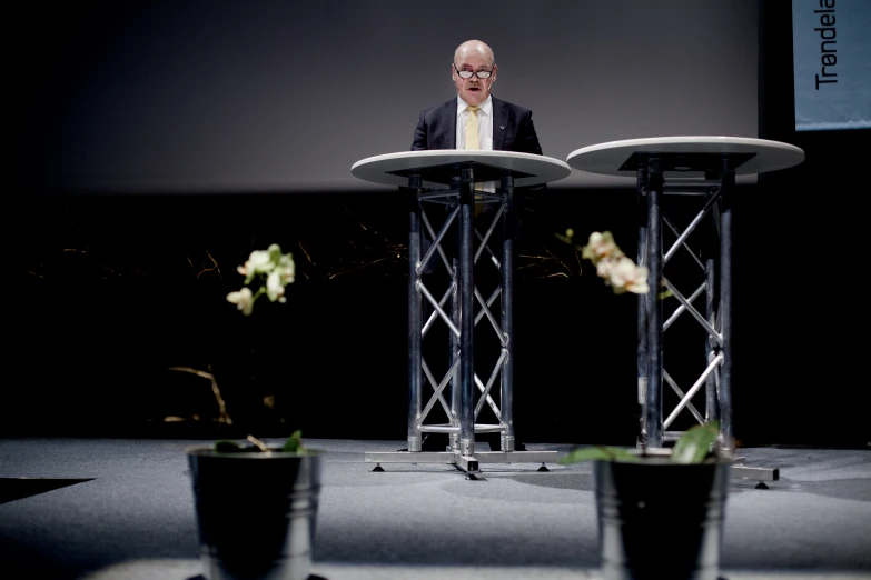 a man sitting in a chair on top of a table