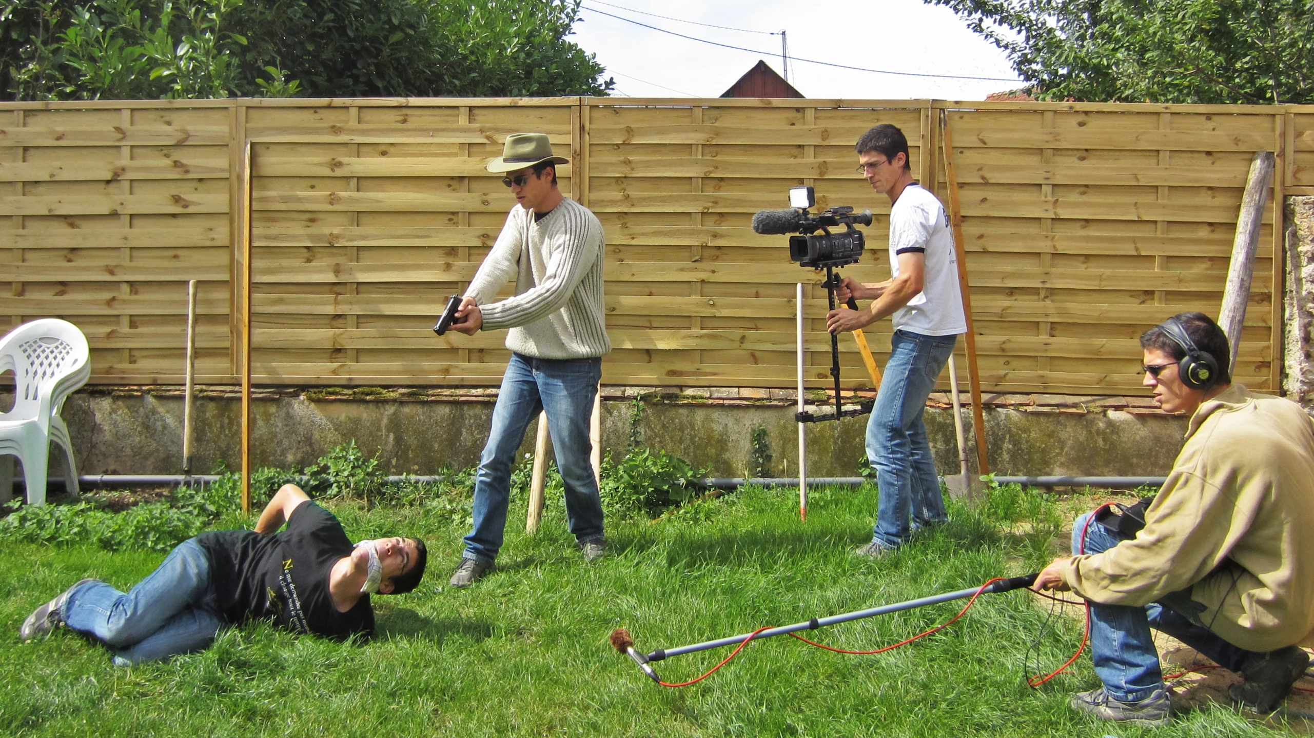 a cameraman and his crew filming an outdoor film