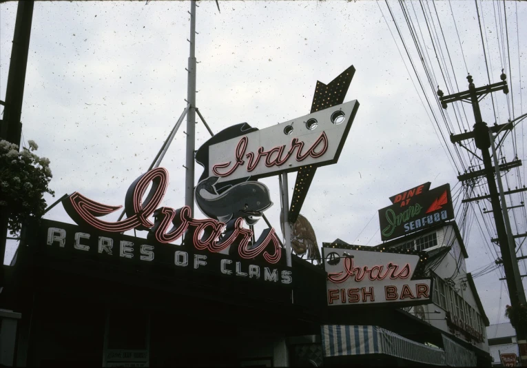 a neon sign for an auto repair shop that sells parts