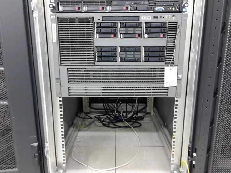 a large server with the wires exposed and wires attached to the sides