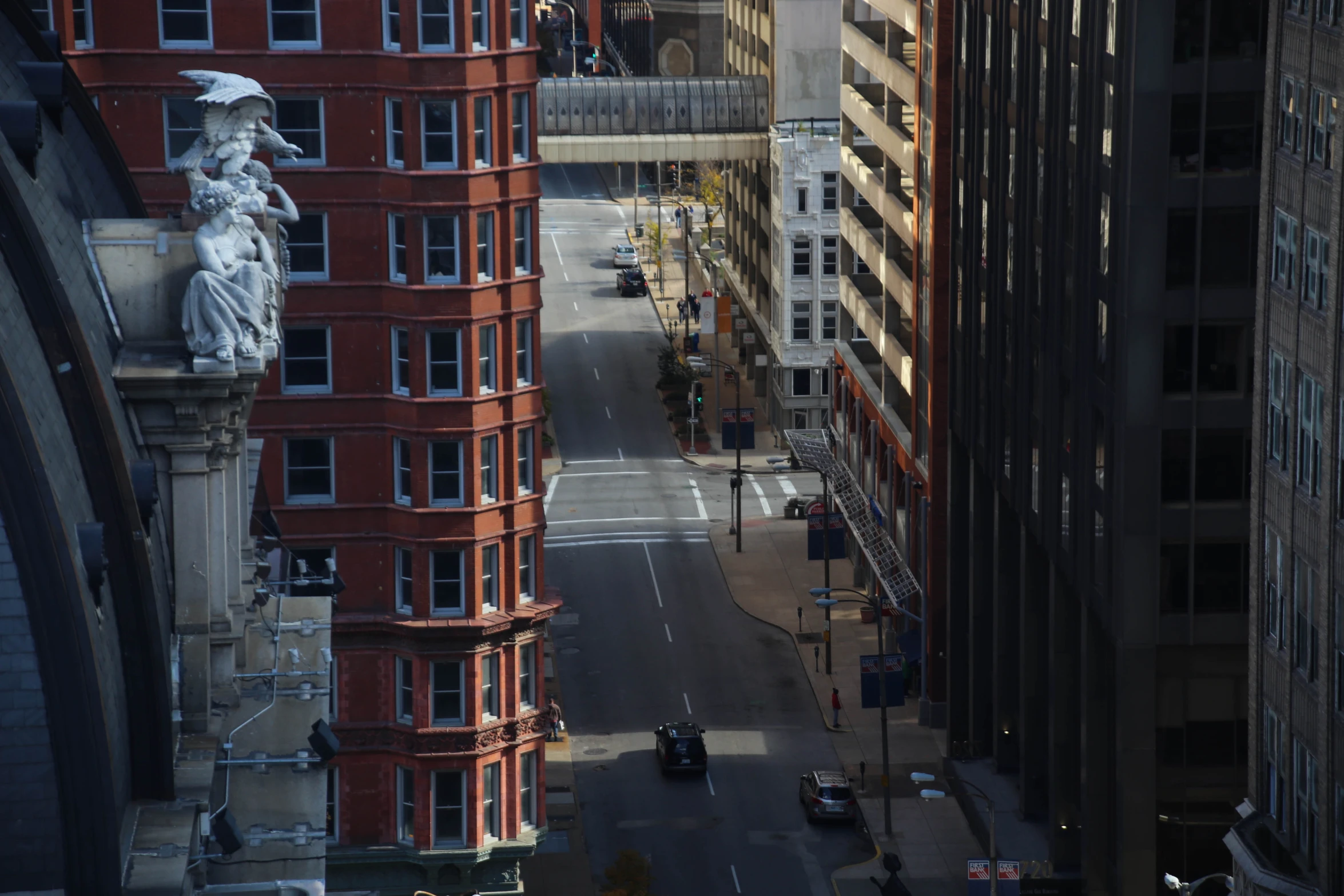 a street in the middle of a city with tall buildings