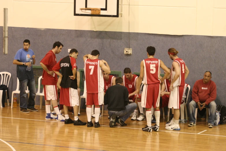 some men are standing in a line during a game