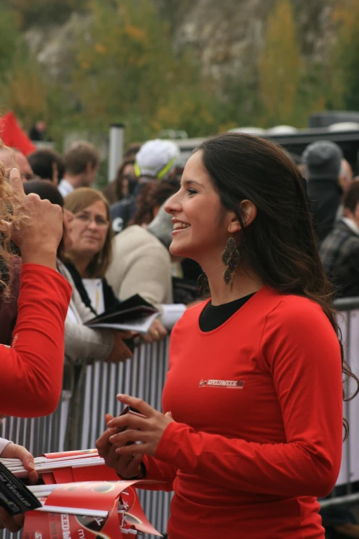 the woman in red shirt is at the event