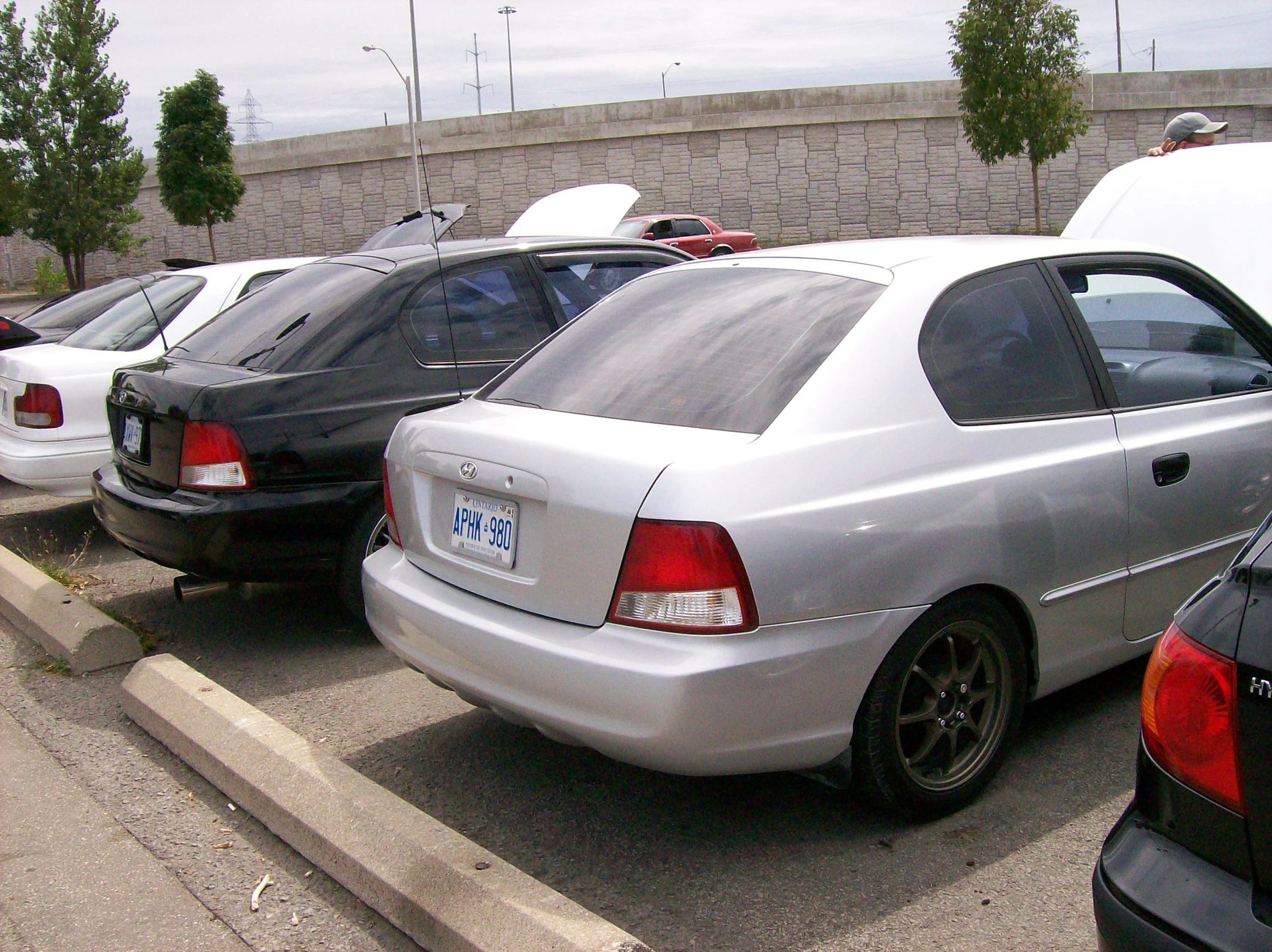 a number of parked cars on a parking lot