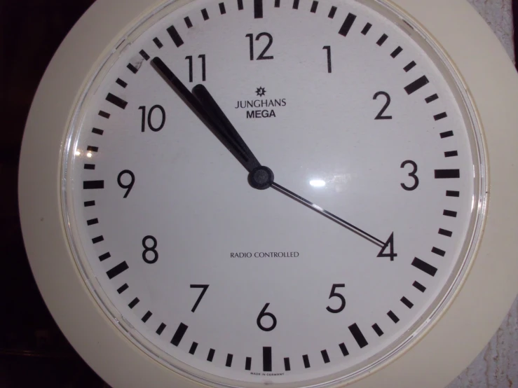 a large white clock sitting inside of a room