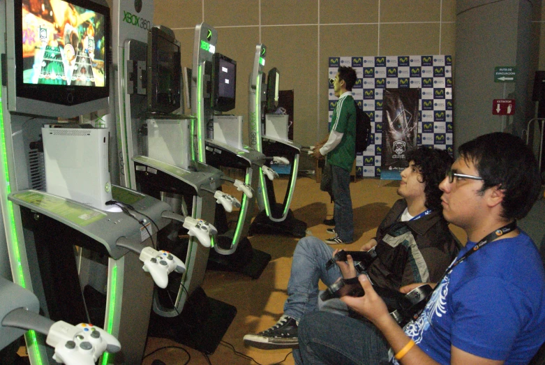 a group of children play video games with remotes