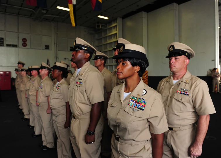 some uniformed women are lined up in line