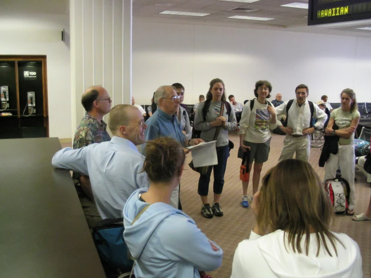 many people walking through an airport terminal