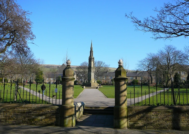 an old gate on the side of a road