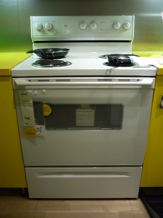 an oven with two burners is shown in this kitchen