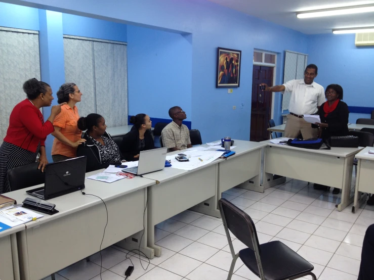 group of men and women in business meeting room