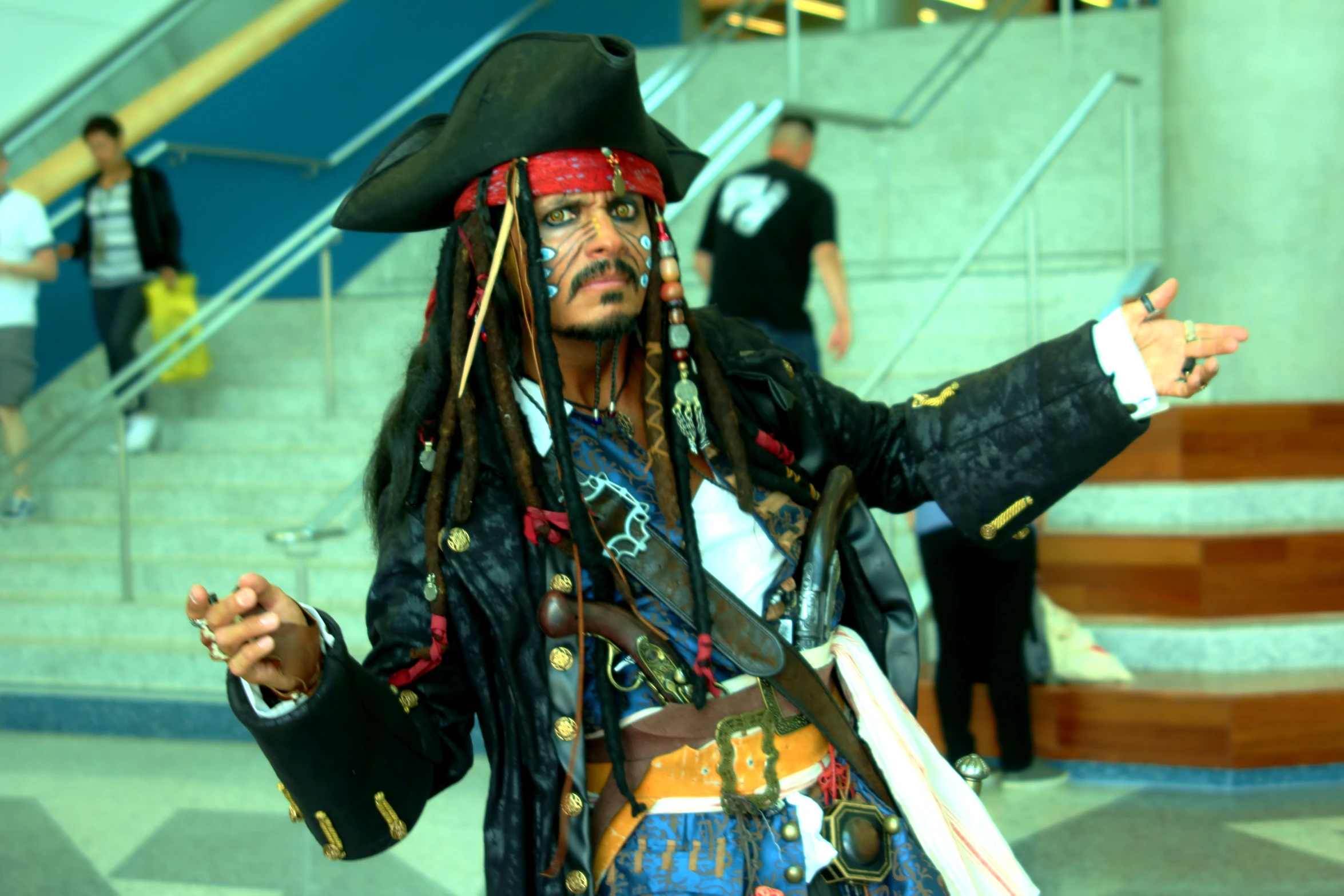 a man with a dreadlock on his head is dressed in costume