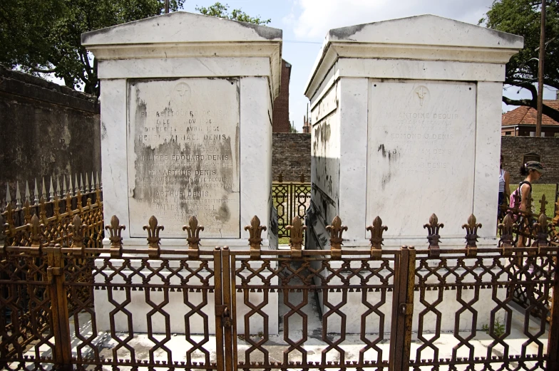 a pair of white graves in a graveyard