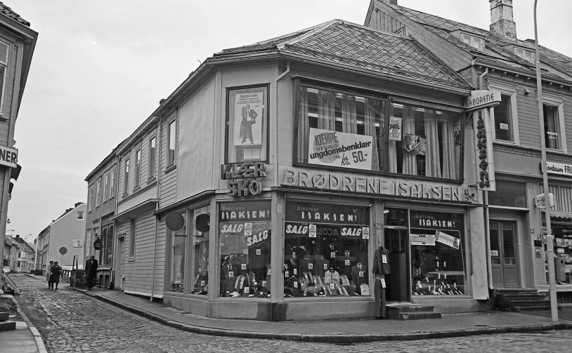 people walking around in front of some shops