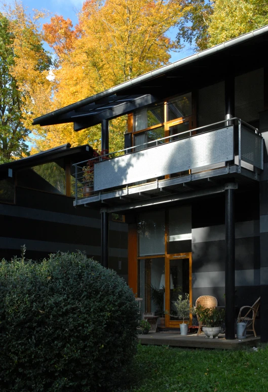 a house with a patio and steps leading to the front door