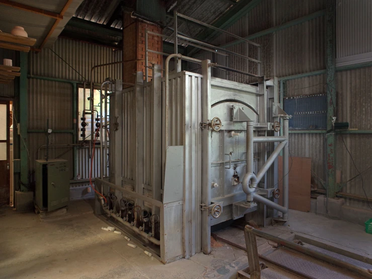 an industrial building with metal and bricks and doors