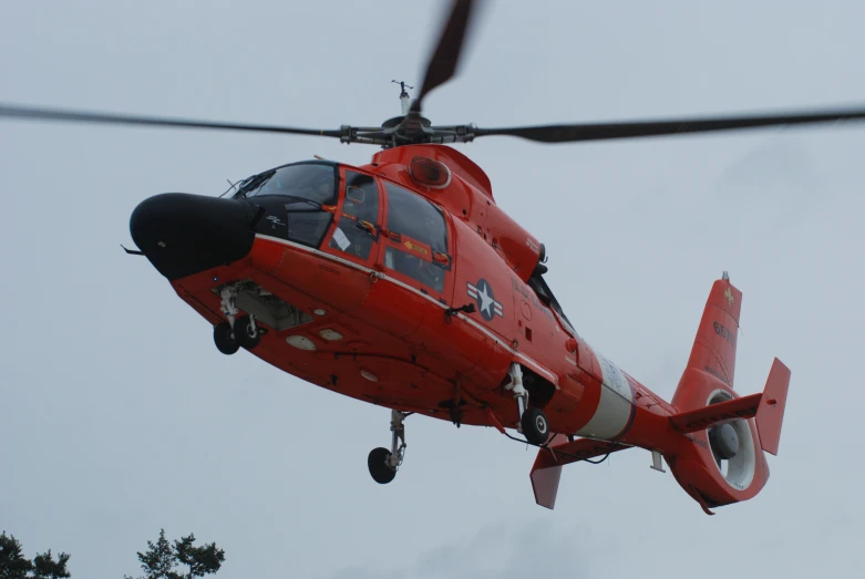 a helicopter is flying in the sky with a propeller