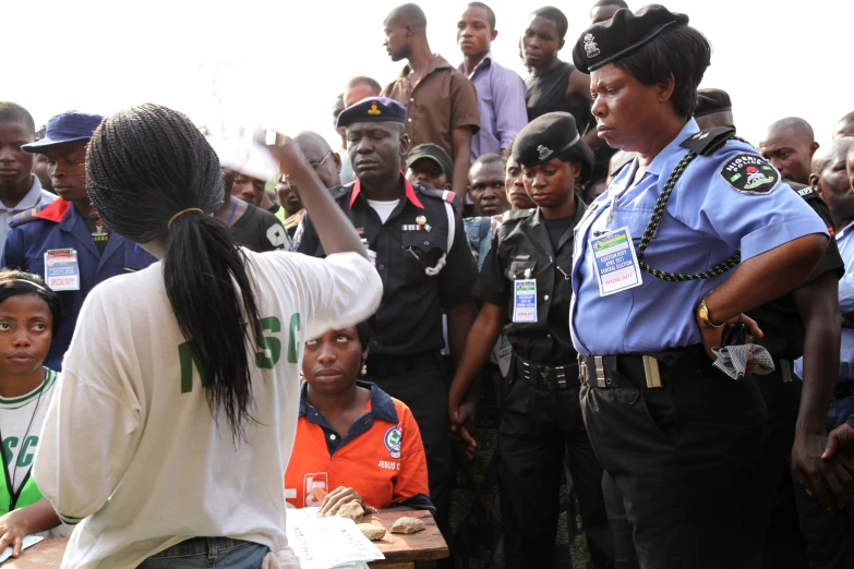 a police officer directing a crowd of people