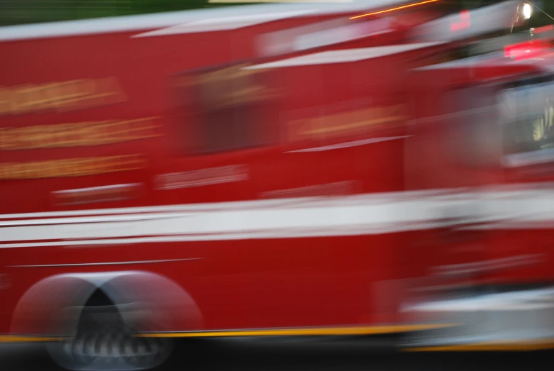 a blurred image of the back of an ambulance