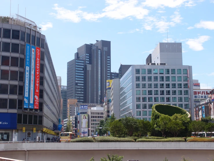 a city street with lots of tall buildings and cars