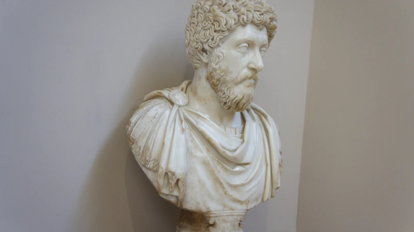 there is a marble bust of a man in white