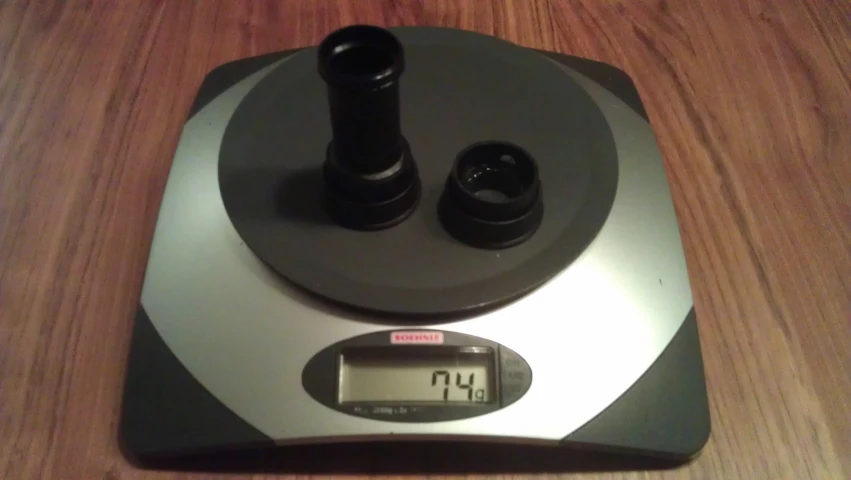 a scale on a table holding different types of ons