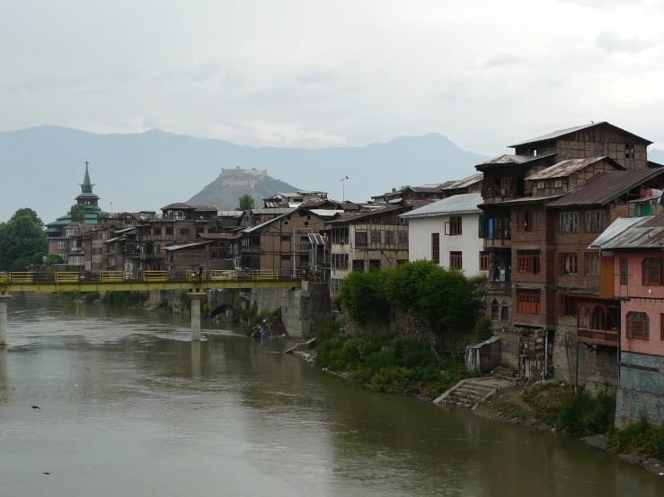 a small river flowing between buildings in a town