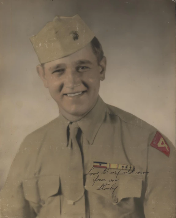 old fashion po with a smiling man in military clothing